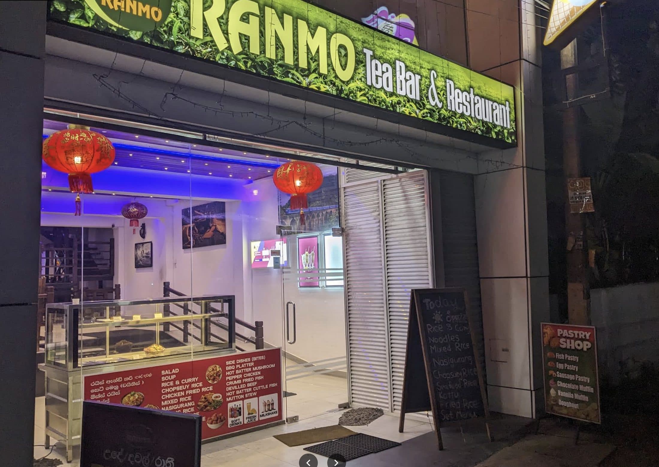 Ranmo Tea Bar and Restaurant's illuminated storefront on Galle Road at night